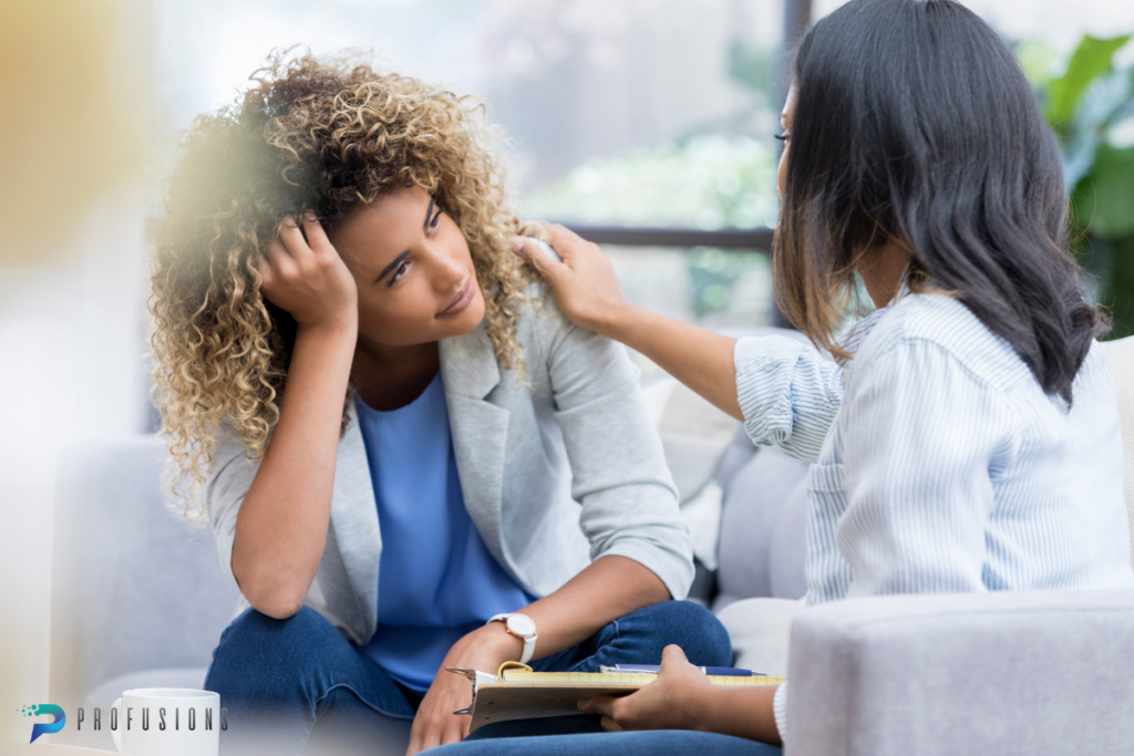 Two women in a comforting conversation.